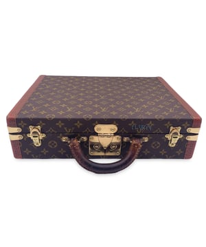 VINTAGE, RRP AS NEW
This gorgeous vintage Louis Vuitton "President" hard-side briefcase is a true collector's item, a symbol of both luxury and functionality that only gets better with age. Crafted from the iconic monogram canvas and accented with genuine leather, this briefcase exudes timeless elegance. The LV monograms are subtly embossed on the trim, adding an extra layer of sophistication to the design.  The rounded leather handle provides a comfortable and durable grip, perfect for carrying this exquisite piece from meeting to meeting. Inside, the canvas interior features a single leather strap with a buckle, offering secure storage for important documents and personal items. The iconic Louis Vuitton "S" lock with key keeps your contents safe, reinforced by two complementary trunk latches that further enhance the case's robust structure.  This briefcase was purchased in 1978, and it bears the initials "H.W.N" printed on the front, a personalized touch that speaks to its unique history. With its distinctive blend of function, craftsmanship, and character, this vintage Louis Vuitton "President" briefcase remains a sophisticated choice for those who appreciate the finer things in life. Condition Rating: C - USEDCondition Details: Some darkness and wear of use on leather handle (the handle will definitely need to be replaced at some point). Some wear of use along the leather trim (some scratches and some fading on LV logos). Some wear of use on corners. Minimal wear of use on the internal lining. The central lock snaps up when you press the push lock, but the spring is already a bit worn out, so the lock doesn't open completely on its own. However, this does not affect its use. The initials of the first owner were printed on the front of the case. Please, see the photos and/or ask if you have any doubts or if you need more information.Measurements (cm):Depth: 7.6Height: 33.0Length: 43.2Other Details: Dustbag? NoKeys? NoBox? No Measurments:  width: 76 mm length: 432 mm height: 330 mm