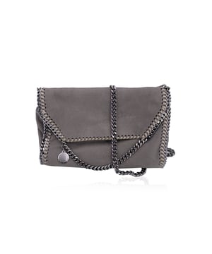 VINTAGE, RRP AS NEW
Discover the perfect fusion of style and sustainability with Stella McCartney's grey canvas Falabella flap crossbody shoulder bag. Crafted from environmentally friendly faux suede, this bag embodies the designer's commitment to luxury without compromise. The sleek grey canvas is paired with striking silver metal chain edging and whipstitch trim, creating a chic yet edgy look that defines the iconic Falabella collection.  The flap closure features a magnetic button, offering both security and ease of access. On the front, a logo-engraved silver metal disc adds a touch of signature elegance. The chain strap allows for comfortable wear across the body or on the shoulder, making it as practical as it is stylish.  Inside, the bag is lined with a vibrant pink logo-jacquard fabric, adding a pop of color and personality to its sophisticated design. There's also a side zip pocket for organizing your essentials. The "STELLA McCARTNEY - Made in Italy" embossing inside further highlights the exceptional craftsmanship and luxury behind this piece.  Perfect for those who are both fashion-conscious and environmentally aware, this Falabella crossbody is a beautiful, vegan-friendly option that doesn't compromise on luxury or style. Condition Rating: A - EXCELLENTCondition Details: Some normal wear of use. Please check the photos carefully and ask if you need to know more details or if you have any doubts.Measurements (cm):Depth: 5.1Height: 16.5Length: 24.1Other Details: Dustbag? NoKeys? NoBox? No Measurments:  width: 51 mm length: 241 mm height: 165 mm