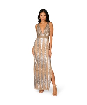 If you are looking to turn heads and break hearts, this sparkling floor-length gown is designed to be in the spotlight. Crafted with intricate hand beading in silver and nude tones, this sleeveless column dress is a luxurious tribute to deco-era glamor. The plunging V-neckline and cinched waist create a stunning silhouette, while the thigh-high slit adds movement to the skirt. A hidden back zipper ensures a seamless fit, allowing the luxurious sequins and beading to shine uninterrupted. Perfect for upscale eveningwear, this gown offers timeless elegance with a shows topping edge.