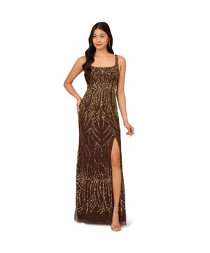 A sparkling night under the stars starts with this beaded mermaid gown. This formal dress features a square neckline, tank straps, a fitted silhouette, and a mermaid skirt. Crafted from mesh knit fabric and embellished throughout by figure-flattering sequin beaded designs, this evening gown is a showstopping look for formal wedding and black-tie events. A hidden zipper closure at the square centre back completes this elegant dress. Paired with metallic heels and crystal jewels, this black-tie dress will make a splash when you RSVP yes.
