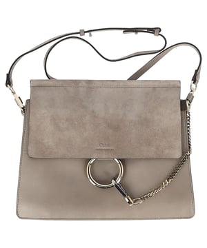VINTAGE, RRP AS NEW
 Elevate your accessory game with the Chloé Motty Faye Medium Shoulder Bag in Grey Suede and Leather. A timeless piece that exudes both sophistication and modern charm, this shoulder bag is crafted from smooth calfskin leather with a luxurious suede flap top. The unique gold-tone chain detail adds a touch of glamour, making this bag a true statement piece. With an adjustable strap, you can wear it comfortably as a crossbody for a hands-free, stylish look. The interior is designed to hold just the essentials, perfect for those who appreciate minimalist elegance. Whether you're out for lunch or attending an evening event, the Faye Medium Shoulder Bag is the perfect companion.
with dust bag

Chloé Motty Faye Medium Shoulder Bag in Grey Suede and Leather
Condition: very good
Signs of wear: No retail tag, No visible sign of wear.,  Light wear on interior
Packaging: Dust bag
Color: grey
Material: Suede | suede
Size: One Size | One Size
Measurements: Width: 60; Height: 220; Length: 320; Handle drop: 0; Strap length: 900
SKU: NAPPUGBBA462128W