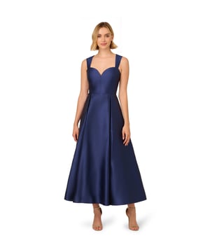 Classic elegance in a garment, this ankle-length sleeveless dress is constructed in crisp and lustrous Mikado fabric. Tailored details harken back to 50s couture with a sweetheart neckline and fit and flare silhouette. The back features a wide cutout at the top for a modern touch. A back zipper and side pockets finish the look.