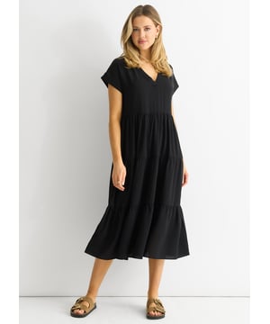 Elevate your occasion wear with our sleek Black V Neck Pocket Smock Midi Dress. Its flattering V neck and convenient pockets make it the perfect blend of style and functionality. Dress it up or down for any event.