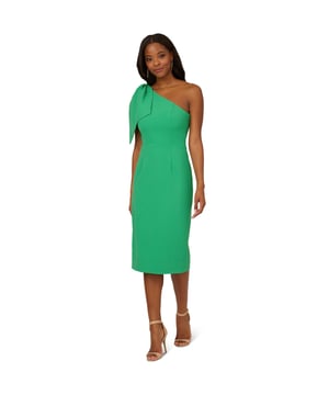 Own every room you walk into in this timeless midi dress. This chic dress features a one shoulder neckline, fitted body, and a mid-length skirt. Crafted from crepe fabric, this cocktail dress has a large bow accent at the shoulder. A zipper closure and slit at the centre back of this midi dress complete the design. Accessorize with your favourite heels and statement earrings for a look that will shine no matter the occasion.