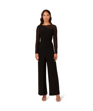 Mesh details add depth and texture to this monochrome wide leg long sleeve jumpsuit. The zip-back bodice features a one-shoulder stretch jersey design with mesh sleeves and shoulders creating a unique asymmetrical illusion neckline. Matching stretch jersey trousers in a wide cut complete this sleek and sophisticated all-in-one ensemble.