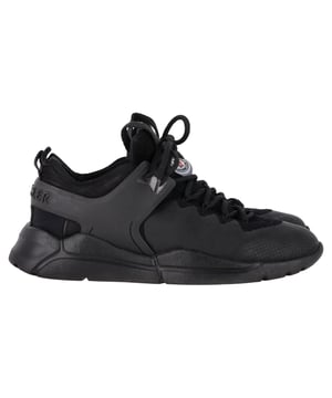VINTAGE, RRP AS NEW
The Moncler Sneakers in Black Rubber and Synthetic Fabric offer a perfect blend of comfort, style, and performance. With a sporty yet luxurious vibe, these sneakers are designed to stand out with their sleek black construction and subtle Moncler branding. The combination of rubber and synthetic fabric gives them both a modern aesthetic and exceptional durability, making them perfect for all-day wear.

Styling Tip: Pair these sneakers with a relaxed, oversized sweater and leggings for a chic athleisure look. For a more elevated casual style, wear them with a tailored jumpsuit or high-waisted jeans. The black design makes them incredibly versatile, easily elevating both sporty and street-style outfits.

Moncler Sneakers in Black Rubber and Synthetic Fabric
Condition: Excellent
Signs of wear: No visible sign of wear. No Mark at insole.,  Very light mark at soles.
Packaging: None
Color: Black 
Material: Rubber and Synthetic Fabric
Size: EU | 39.5
Measurements: Heel height: 40; Insole length: 320
SKU: MRPPUGBSH461591W