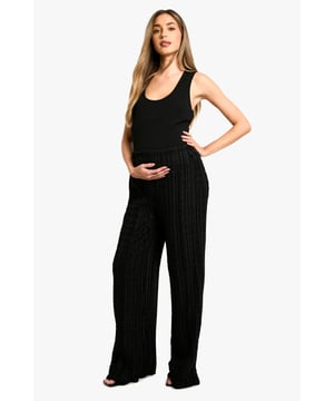 Textured wide-leg trousers with a crinkle effect
        Comfortable jersey fabric for all-day wear
        Drawstring waist for adjustable fit
        Relaxed silhouette perfect for maternity wear
        Versatile design suitable for various casual occasions
    
    Embrace comfort and style during your pregnancy with these textured wide-leg trousers from Boohoo. The crinkle effect adds a touch of interest to the relaxed silhouette, while the jersey fabric ensures all-day comfort as your body changes. The drawstring waist allows for easy adjustment, accommodating your growing bump with ease. Style these trousers with a fitted tank top and a lightweight blazer for a polished yet comfortable look perfect for family gatherings or casual outings. For a more laid-back ensemble, pair with a loose-fitting tee and trainers. The versatile design of these trousers makes them a wardrobe staple that can be dressed up or down to suit various casual occasions throughout your pregnancy and beyond.