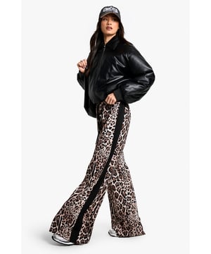 Eye-catching leopard print pattern
        Flattering wide-leg silhouette
        Contrasting side stripes for added flair
        High-waisted design for a lengthening effect
        Lightweight woven fabric for all-day comfort
    
    Make a bold statement with these striking leopard print trousers, perfect for the fashion-forward Boohoo girl. The wide-leg cut offers a relaxed fit that's both on-trend and comfortable, while the high waist creates a flattering silhouette. The contrasting side stripes add a sporty edge, making these trousers versatile enough for various casual occasions. Style them with a cropped black top and trainers for a laid-back daytime look, or dress them up with a sleek bodysuit and heels for a night out with friends. These trousers are ideal for family gatherings, brunch dates, or casual shopping trips. The lightweight fabric ensures you'll stay cool and comfortable, no matter where your day takes you. Embrace your wild side and stand out from the crowd in these eye-catching trousers that perfectly blend comfort with cutting-edge style.
