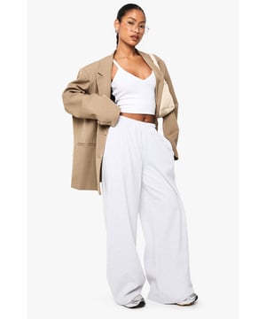 Ribbed texture adds subtle dimension and visual interest to these straight-leg trousers
        High-rise waistband with comfortable stretch for all-day wear
        Relaxed straight-leg silhouette offers effortless movement
        Versatile design perfect for mixing and matching with your wardrobe staples
        Soft fabric blend provides comfort without compromising on style
    
    These Boohoo Basics ribbed straight-leg trousers are the foundation of countless stylish looks. The relaxed fit creates a laid-back silhouette that works brilliantly with cropped tops for a balanced proportion, as shown by our model. Style with trainers for daytime casual outings or dress up with a structured blazer for smart-casual settings. The ribbed texture adds a contemporary touch to these otherwise minimalist trousers, making them ideal for family gatherings or weekend brunches. For cooler days, layer with an oversized jumper or cardigan for a cosy yet put-together ensemble. These trousers offer the perfect combination of comfort and style, making them an essential addition to your casual wardrobe rotation.
