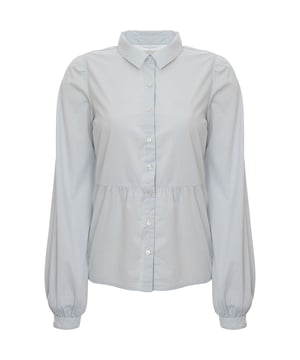 The spread collar blouse offers a button placket, volume sleeves, button cuffs, frill hem, regular fit, and true-to-size dimensions.