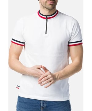 100% Cotton. The men's Half-Zip Polo Shirt blends clean design with French flag-inspired tricolor cuffs and collar. All-cotton knit fabric gives it a casual, breathable feel, and the tailored fit is inspired by sport chic style