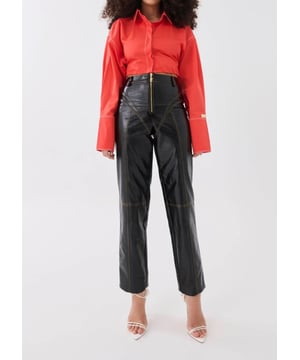 100% PU. High rise, straight leg fashion trousers. Sculpted contrast muted yellow stitching. P.E Nation gold-plated centre-front zipper. Soft PU fabrication
