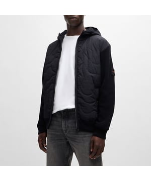 Mens BOSS Kalbero Relaxed Fit Padded Jacket in black.new seasonal design quilting on a light weight padded nylon - sleeves and back in half cardigan rib - double rib hem and cuffs with outside linking - front zip attached on top - visible press button with logo at pockets - squared logo at back inside - light weight padded hood with elasticated binding at opening - new herringbone logo patch at sleeve - 94% cotton 5% polyamide 1% elastane