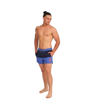 These short men's swim shorts offer a fresh and modern design, ideal for those looking for comfort and style in their water activities or on lazy days in the sun. With their lightweight fabric and practical details, they are the perfect men's swim shorts to enjoy the summer.

 Details:
 - Adjustable elastic waist with drawstring.
 - Side pockets.
 - Embossed silicone label on the back.
 - Mesh inner lining.
 - Brand graphics.
 - Made of lightweight, quick-drying fabric.

 Men's swim shorts are an essential item of clothing for those who love to enjoy the water, whether at the beach, in the pool, or anywhere else. Although they are often considered a simple and functional garment, the Munich men's swim shorts can be a stylish and fashionable choice. The long men's swim shorts are a garment that defines us, so it is important to find a men's swim shorts that helps us project our personality.
 Composition: 100% Polyester
 Care:
Hand wash.
 Do not use bleach or fabric softeners.
 Air dry.
