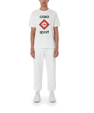 Casablanca CASA Sport Logo T-Shirt MF23-JTS-001-21 – White

Elevate your casual wardrobe with the Casablanca CASA Sport Logo T-Shirt, a premium essential that blends luxury with a sporty aesthetic. Crafted from high-quality 100% cotton, this t-shirt offers a soft, breathable feel for all-day comfort. Featuring the signature CASA Sport logo print on the chest, it embodies Casablanca’s effortlessly stylish and contemporary design.

Features:

Brand: Casablanca

Style: Short-Sleeve Crewneck T-Shirt

Color: White
Material: 100% Cotton – soft and breathable

Fit: Regular fit for a comfortable and stylish look

Design: Bold CASA Sport logo graphic on the chest