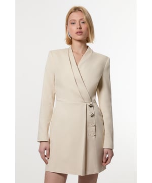 Make a statement with our striking occasion dress, which features a layered design and button detailing. Style it simply with heeled boots or statement heels for a look that will take you from wedding guest days to party season events. Soft Structured Tailored Wrap Blazer Dress Flattering Fitted Silhouette V Neckline Layered Design Unique Wrap Style Button Detailing
