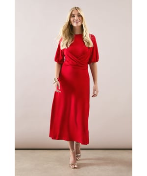 Elegant midaxi length dress with sophisticated waist detailing for a flattering silhouette
        Soft jersey fabric offers exceptional comfort and gentle stretch throughout the day
        Stylish short sleeves with subtle volume for a contemporary touch
        Classic crew neckline provides versatility for accessorising
        Delicate keyhole detail at the back adds an unexpected finishing touch
    
    This Wallis jersey dress combines sophistication with everyday comfort, making it a versatile addition to your wardrobe. The thoughtfully designed waist detail creates a graceful drape that complements your figure, while the midaxi length offers a modern yet timeless appeal. Style with metallic strappy sandals and stacked bangles for family gatherings or weekend brunches. For a more casual daytime look, pair with your favourite trainers and a denim jacket. The easy-care jersey fabric ensures this dress maintains its shape throughout the day, making it perfect for those occasions when you want to look polished without sacrificing comfort. Ideal for transitioning from office to evening drinks or for sophisticated casual events where you want to project effortless glamour.