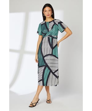 Striking geometric print midi dress with contemporary twist waist detail
        Elegant crew neckline and flattering short sleeves
        Sophisticated midi length perfect for day-to-evening versatility
        Fully lined for comfort and smooth silhouette
        Distinctive abstract pattern creates visual interest and modern appeal
    
    This eye-catching Principles midi dress combines comfort with contemporary style through its distinctive geometric print and clever twist waist design. The woven fabric drapes beautifully, creating a flattering silhouette that works wonderfully for various daytime occasions. Style with strappy sandals and minimal jewellery as shown for casual lunches or family gatherings. For cooler days, layer with a lightweight cardigan and pair with white trainers for an effortless weekend look. The versatile midi length makes this dress ideal for garden parties or informal brunches, whilst the bold pattern ensures you'll stand out for all the right reasons. Machine washable and easy to care for, this dress offers both practicality and style for your everyday wardrobe.
