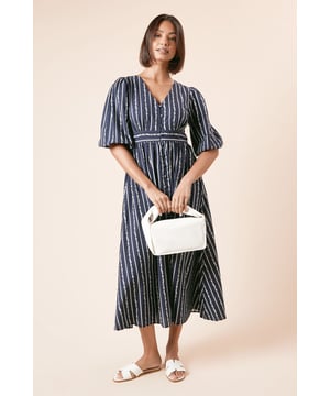 Crafted from breathable cotton poplin fabric for all-day comfort
        Elegant V-neckline with full button-front fastening
        Flattering defined waistband creates a feminine silhouette
        Voluminous three-quarter length sleeves with gentle puff detail
        Midi-length hem offers versatile styling options for various occasions
    
    This Dorothy Perkins shirt dress combines timeless style with everyday wearability. The classic striped pattern creates a slimming vertical effect whilst the button-front design allows for adjustable coverage. Perfect for casual gatherings, the dress can be styled with flat sandals and a structured handbag for weekend brunches with friends. For cooler days, layer with a lightweight cardigan and pair with white trainers for a relaxed yet put-together look. The cotton fabric ensures breathability and comfort throughout the day, making it an ideal choice for family gatherings or baby showers. Accessorise with delicate jewellery to maintain the dress's effortless charm, or add a woven belt to further define the waist for a more tailored appearance.