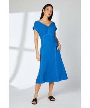 Flattering V-neckline for a feminine touch
        Distinctive seam detailing adds visual interest
        Practical side pockets for convenience
        Midi length offers versatile styling options
        Short capped sleeves provide arm coverage
    
    This gauze midi dress from Principles radiates effortless charm for various daytime occasions. The lightweight cotton fabric ensures comfort, while the seam detailing creates a figure-enhancing silhouette. Style this versatile piece for a family lunch by pairing it with flat sandals and a woven tote. For a casual day out, layer with a denim jacket and trainers for an on-trend look. The V-neckline allows for statement necklaces, making it easy to dress up or down. Perfect for warm weather, this dress can take you from a leisurely brunch to an afternoon in the park with ease. Its adaptable nature makes it a wardrobe staple for the fashion-conscious woman seeking both style and practicality in her everyday attire.