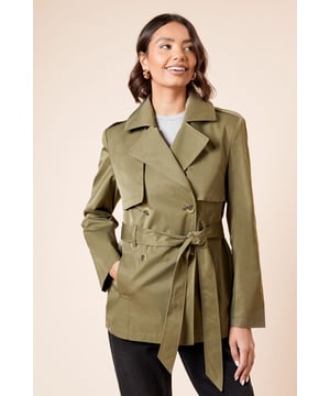 Double-breasted design with classic notched lapels for a timeless silhouette
        Adjustable belted waist to create a flattering, feminine shape
        Practical storm flap detail adds authentic trench coat styling
        Functional side pockets perfect for keeping essentials close at hand
        Versatile mid-length cut suitable for layering throughout the seasons
    
    This Dorothy Perkins trench coat offers the perfect balance of classic style and modern practicality. The double-breasted design creates a structured look that can be dressed up or down with ease, while the belted waist allows you to customise the fit to your preference. Style with straight-leg trousers and white trainers for casual weekend brunches, as seen on our model, or pair with a midi dress and ankle boots for family gatherings. The collared neckline and clean lines make this coat a wardrobe essential that transitions effortlessly from work to weekend. For cooler days, layer over a lightweight jumper and finish with gold-toned jewellery for a polished look that's perfect for coffee dates or shopping trips with friends. This versatile piece will quickly become your go-to outerwear option for unpredictable British weather.