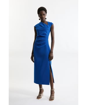 Elevate your occasion wear wardrobe with our midi dress, with a fit that hugs the curves, an asymmetric neckline, and ruched detailing. Style it with statement strappy heels for an occasion look that is guaranteed to turn heads wherever you step. Structured Crepe Asymmetric Neck Midi Dress High Quality Crepe Fabric Statement Asymmetric Neckline Body Contouring Ruched Detailing Figure Hugging Silhouette Thigh High Leg SplitBrowse this seasons work dresses or discover the full range of workwear now.