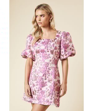 Elegant jacquard fabric with a subtle metallic sheen for a touch of glamour
        Flattering square neckline frames the dcolletage beautifully
        Statement puff sleeves add a contemporary twist to this classic silhouette
        Mini length designed specifically for petite frames
        Fully lined for comfort and a smooth fit
    
    This Dorothy Perkins jacquard mini dress combines timeless elegance with modern detailing. The structured fabric creates a flattering shape while the square neckline offers a sophisticated touch that's perfect for special occasions. Style with strappy heels and delicate drop earrings as shown for formal events such as weddings or graduation ceremonies. For race day, add a fascinator and clutch bag to complete your ensemble. The versatile design transitions beautifully from day to evening - pair with a tailored blazer and court shoes for a christening or baby shower, then remove the layer for evening drinks. The mini length showcases legs whilst the modest neckline and puff sleeves ensure you'll feel appropriately dressed for any formal gathering. This piece strikes the perfect balance between trend-conscious style and timeless appeal.