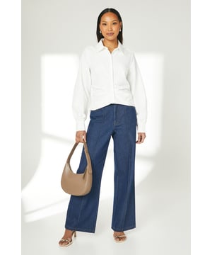 Elegant gathered detailing adds a touch of sophistication
        Long sleeves with subtle volume for a refined silhouette
        Classic collared neckline for a timeless look
        Versatile woven fabric suitable for various occasions
        Button-down front for easy wear and styling options
    
    This Principles gathered detail long sleeve shirt is a versatile addition to your wardrobe, perfect for elevating your everyday style. The subtle gathering adds a feminine touch to the classic shirt design, creating interest without overwhelming the overall look. Style this piece effortlessly for a range of casual events - pair it with wide-leg denim trousers and trainers for a relaxed weekend brunch, or tuck it into a midi skirt with ballet flats for a family gathering. The shirt's adaptable nature allows for easy transition from day to night - simply swap your casual bottoms for tailored trousers and add some statement earrings for an impromptu dinner date. Its neutral palette ensures it will complement a variety of outfits, making it a go-to piece for those moments when you want to look put-together with minimal effort.