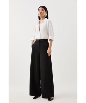 Experience sleek tailoring in a pair of petite straight leg trousers, made with crepe fabric, featuring a flattering, relaxed fit and a comfortable high waistline. Style it with a shirt more formal look, or with a T-shirt and trainers for a more laid back approach. Petite Viscose Crepe Straight Leg Trouser High Quality Crepe Fabric Comfortable High Waistline Flattering Straight Leg Fit Pocket Accents Belt Loop Features Expertly designed for those 5'3" and under, our Petite pieces are perfectly proportioned for a smaller frame using shorter lengths.