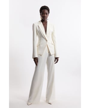 Experience elevated tailoring in a pair of straight leg trousers, featuring a flattering, relaxed fit, seam detailing for a seamless fit, and a comfortable high waistline. The sleek design makes them easy to style with anything, from a crisp button up shirt for a formal look, or with a T-shirt and trainers for a more laid back approach. Tailored Crepe Seam Detail Straight Leg Trousers High Quality Crepe Fabric Comfortable High Waistline Flattering Straight Leg Fit Statement, Pronounced Seam Detailing Pocket Accents Sleek, Minimal Design