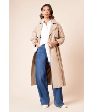 Classic double-breasted design with statement buttons for timeless appeal
        Adjustable belted waist to create a flattering silhouette
        Longline cut offering extra coverage and sophisticated drape
        Practical storm flaps and shoulder epaulettes for authentic trench styling
        Collared neckline with wide lapels for a structured, polished finish
    
    This Dorothy Perkins longline trench coat combines practicality with effortless style for your everyday wardrobe. The adjustable belt allows you to customise the fit according to your outfit, whether worn loosely for a relaxed look or cinched to define your waist. Style with wide-leg trousers and loafers as shown for a contemporary daytime ensemble, or layer over a casual dress with trainers for weekend brunches with friends. The regular fit accommodates light layering underneath, making it ideal for transitional weather. Perfect for family gatherings, coffee dates or shopping trips, this versatile coat will quickly become your go-to outerwear option. The woven fabric offers structure while maintaining a fluid movement that complements various silhouettes, ensuring you stay stylishly comfortable throughout the day.