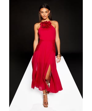 Striking corsage detail adorns the halter neckline for a dramatic, feminine touch
        Elegant maxi length with flowing georgette fabric that creates graceful movement
        Sophisticated high neck design balances the sleeveless silhouette beautifully
        Flattering side split adds a contemporary edge and ease of movement
        Fully lined for comfort and a flawless drape that maintains the dress's shape
    
    Make a statement at your next special occasion with this show-stopping halter neck maxi dress from Warehouse's exclusive RUNWAY 1.8.1.8 collection. The standout corsage detail creates a bold focal point that commands attention, whilst the flowing georgette fabric cascades elegantly to the floor, creating a sense of drama with every step. Style with metallic strappy heels and statement earrings as seen on our model for a refined evening look. Perfect for summer weddings, formal garden parties or race day events where sophistication is key. The clean lines and contemporary design reflect the confident, edgy aesthetic that Warehouse is renowned for, whilst maintaining a distinctly feminine appeal. The side split detail offers both practical movement and a subtle glimpse of leg for a modern finish.