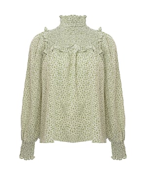 Body: 100% Polyester. A glamorous high neck smock blouse in green floral is the perfect statement piece for any wardrobe. The 100% polyester fabric ensures a comfortable fit and easy care, making it a practical choice for both day-to-day wear and special occasions. Its vibrant green floral pattern exudes a fresh and lively vibe, ideal for those who want to add a touch of nature-inspired elegance to their outfit. Whether paired with jeans for a casual look or a skirt for a more formal ensemble, this blouse is sure to turn heads and elevate any look.