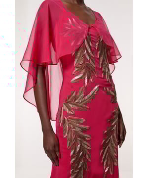 Feel like the centre of attention in our maxi dress, with a flowing silhouette that pools at the feet, and sparkling beaded detailing in the shape of feathers in the front. Pair this piece with strappy heels for an occasion look perfect for prom nights and formal events. Feather Embellished Woven Cape Sleeve Maxi Dress Sparkling Feather Shaped Embellishments Figure Skimming, Flowing Fit Plunging V Neckline Sheer Cape Sleeves Statement Strappy Back