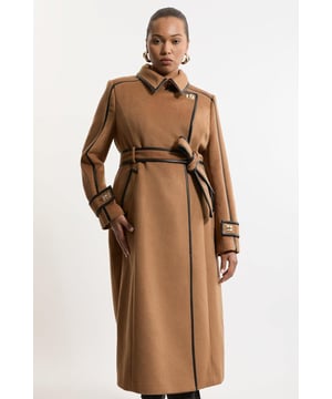 Feel elevated no matter the weather in our plus size midi length coat, made in high quality, thick wool, featuring a fit that flatters the figure and faux leather trims. Wear it over any outfit, whether heading out for dinner or to the office. Plus Size Wool Blend Faux Leather Trim Belted Tailored Midi Coat High Quality Wool Blend Fabric Flattering Fitted Bodice Straight Hanging Skirt Metallic Clasp Buttons at Collar and Cuffs High, Collared Neckline Belted Waistline Unique, Faux Leather Trims Expertly designed for those UK size 18/US size 14 and above, our plus size clothing collection is perfectly proportioned to ensure you look stylish at every shape. Discover our collection of plus size coats and jackets or browse our range of plus size clothing now.