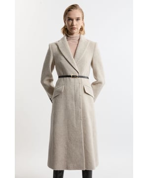 Feel elevated no matter the weather in our midi length coat, made in high quality, thick Italian wool, featuring a belted waist for a flattering fit, and a button fastening. Wear it over any outfit, whether heading out for dinner or to the office. Premium Italian Manteco Wool Single Breasted Belted Tailored Midi Coat High Quality Italian Wool Flattering Straight Silhouette Belted Waist for a Cinched Silhouette Contrasting Faux Leather Detailing Formal, Collared Neckline Pocket Features Midi Length