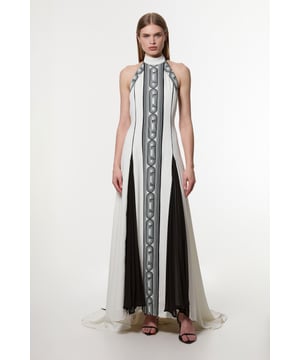 Architectural influences, brought to life through print; Karen Millen presents a new collection in collaboration with Amelia Graham. Elevate your every day wardrobe in our maxi dress, with a bodycon fitting bodice which flows into a flared skirt. The geometric, monochrome print makes a statement, while the backless design is certain to catch eyes. Style it with strappy heels for an occasion look that is guaranteed to turn heads wherever you step. Amelia Graham Printed Statement Woven Gown High Quality, Soft Jersey Fabric Statement Geometric Printing High, Halter Neckline Fit and Flare Silhouette Striking Backless Design Strappy Back Detailing Tie Back Fastening