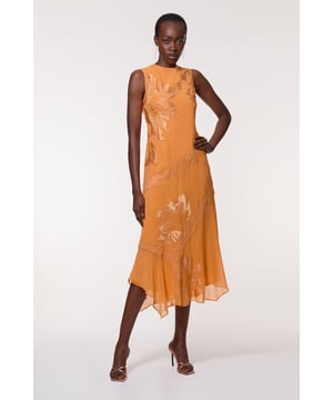 This Karen Millen petite maxi dress radiates elegance and charm, perfect for those special occasions that demand a touch of glamour. The intricate applique and lace detailing adorns the dress, creating a captivating visual interest that's sure to turn heads. The sleeveless design and crew neckline offer a classic silhouette, while the open back with its alluring keyhole detail adds a dash of allure. The flowing georgette fabric ensures comfort and ease of movement, ideal for dancing the night away at weddings or formal events. The asymmetrical hemline provides a contemporary twist to this otherwise timeless piece. Style with strappy heels and delicate jewellery for a refined look, or pair with a tailored blazer for cooler evenings. This versatile dress is a stunning choice for a range of formal gatherings, from summer garden parties to elegant evening soirees.   Sleeveless maxi dress with elegant applique and lace detailing Crew neckline for a sophisticated look Striking open back design with keyhole detail Flowy georgette fabric for graceful movement Asymmetrical hemline adds a modern touch