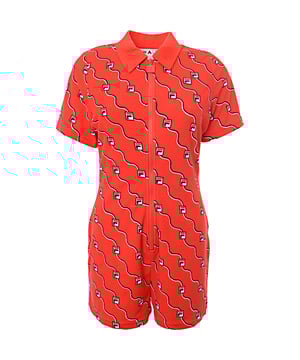 Main: 20% Polyester, Main: 80% Cotton Make a bold statement with the Fila All Over Logo Zip Front Playsuit in vibrant red. Crafted from a blend of 80% Cotton and 20% Polyester, this playsuit offers a comfortable, breathable fit with added durability. The all-over logo print adds a trendy, sporty touch, while the zip front design ensures easy wear. Perfect for casual outings or a day of fun activities, this playsuit combines style and comfort effortlessly. ??