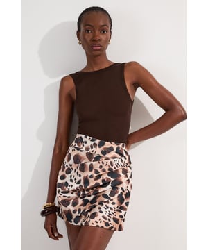 Make a statement at your next soiree with this captivating animal print mini skirt, featuring ruched detail for a figure-flattering silhouette. Pair it with a sleek bodysuit or a crisp white blouse for a sophisticated ensemble perfect for cocktail parties or upscale dinners. For a more daring look, team it with a matching animal print top and strappy heels. The versatile design allows for both dressed-up and casual styling options; wear it with a leather jacket and ankle boots for a chic day-to-night transition. This skirt is an ideal choice for those seeking to inject a touch of wild glamour into their wardrobe, suitable for a range of occasions from formal events to nights out on the town.  Striking animal print pattern for a bold, eye-catching look Ruched detailing adds texture and flattering dimension Structured viscose satin fabric offers a luxurious feel and drape Mini length design for a flirty, leg-lengthening effect High-waisted silhouette accentuates the waistline