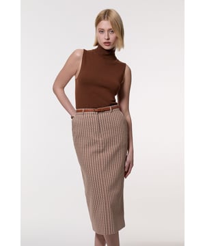 Experience updated wardrobe essentials with our midi skirt, with a straight silhouette and a high waistline, creating a universally flattering fit. The geometric print adds immediate intrigue, elevating this piece beyond a basic. Style this piece with anything, from the matching jacket and strappy heels, to a knit jumper, tights, and boots. Jacquard Tailored Midi Pencil Skirt High Quality Jacquard Fabric Sleek, Minimal Design Comfortable High Waistline Flattering Figure Hugging Silhouette Unique Geometric Print Matching Jacket Sold Separately