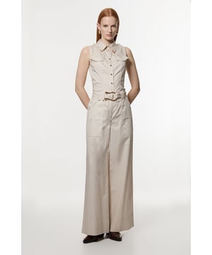 Embrace sophisticated style with these cotton sateen utility trousers. The wide-leg cut offers both comfort and a fashion-forward silhouette, perfect for the modern woman who values both style and practicality. Pair these versatile trousers with a fitted blouse and pointed flats for a polished daytime ensemble, ideal for family gatherings or casual workplace settings. For a more relaxed look, style with a crisp white t-shirt and trainers. The high-waisted design and wide-leg cut work together to create a leg-lengthening effect, making these trousers a flattering choice for various body types. Whether you're running errands or meeting friends for brunch, these trousers will keep you looking effortlessly stylish.  Wide-leg silhouette for a contemporary and comfortable fit Striking gold hardware belt detail adds a touch of glamour Utility-inspired design with practical pockets High-waisted style for a flattering and elongating effect Crafted from cotton sateen for a subtle sheen and smooth feel