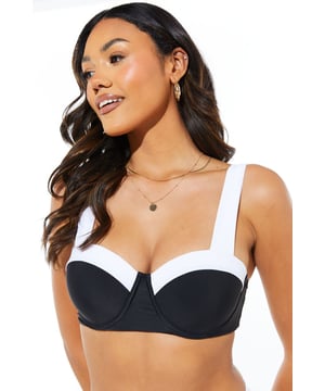 Striking contrast design for a bold beach look
        Moulded cups provide excellent support and shape
        Wide, comfortable straps for all-day wear
        Bandeau neckline offers versatile styling options
        Matching bottoms available for a coordinated set
    
    Make a splash this summer with our eye-catching Contrast Moulded Bikini Top. This chic piece combines style and comfort, perfect for your next beach getaway or poolside lounging. The moulded cups ensure a flattering silhouette, while the wide straps offer much-needed support for various activities. The bandeau neckline allows for multiple styling options - wear it with or without straps to suit your mood. Pair it with the matching bottoms for a coordinated look, or mix and match with other swimwear pieces for a personalised style. Whether you're sunbathing, taking a dip, or enjoying beachside cocktails, this versatile top will keep you looking fabulous. Accessorise with oversized sunglasses and a wide-brimmed hat for the ultimate resort-ready ensemble. This bikini top is a must-have addition to your holiday wardrobe, ensuring you stand out for all the right reasons on your sunny adventures.