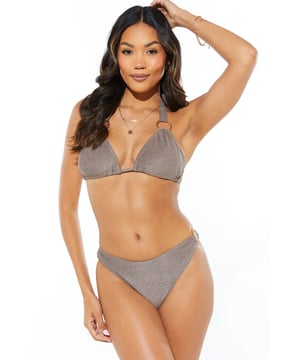 Stylish halterneck design for enhanced support
        Eye-catching ring detail adds a touch of glamour
        Adjustable ties at neck and back for a customised fit
        Metallic yarn blend fabric for a subtle shimmer effect
        Matching bikini bottoms for a coordinated beach look
    
    Make a splash this summer with our Ring Detail Halterneck Bikini Top. This chic swimwear piece combines style and comfort, perfect for your next beach getaway or poolside lounging. The halterneck design offers excellent support, while the adjustable ties allow you to achieve your ideal fit. Pair with the matching bottoms and accessorise with oversized sunglasses and a wide-brimmed hat for a look that exudes holiday glamour. Whether you're taking a dip in the sea, sunbathing on the sand, or sipping cocktails at a beach bar, this versatile bikini top will ensure you look and feel fabulous. For a complete ensemble, throw on a lightweight kaftan and slip into some stylish sandals when it's time to leave the beach.