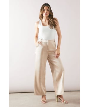 Chic square cut design for a modern silhouette
        Ankle grazer length perfect for showcasing footwear
        Wide-leg style offering comfort and sophistication
        Clean-lined waistband for a sleek finish
        Versatile woven fabric suitable for various occasions
    
    Embrace effortless elegance with these square cut ankle grazer trousers from Wallis. The wide-leg silhouette presents a contemporary twist on classic tailoring, ideal for the fashion-forward woman who values both style and comfort. Perfect for daywear, these trousers can be styled with a crisp white blouse and ballet flats for a sophisticated look at family gatherings. For a more casual ensemble, pair with a soft knit jumper and trainers. The ankle grazer length allows you to showcase your favourite footwear while maintaining a polished appearance. The clean lines and regular fit make these trousers a versatile addition to your wardrobe, easily transitioning from a day at the office to an evening out with friends. Add a touch of glamour with statement jewellery and a clutch bag for those special occasions where you want to feel both comfortable and chic.