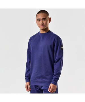Mens Weekend Offender F Bomb Crewneck Sweatshirt in navy.- Crew neck.- Ribbed collar  cuffs & hem.- Weekend Offender Metal square logo badge on upper sleeve.- Tonal nylon patches on the shoulders & side panels.- Cotton brushback fleece fabric.- 100% Cotton.- Ref: SWSS2401NAV
