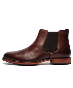 Introducing the high-end Argyll Leather Chelsea Boot for menwhere timeless craftsmanship meets modern sophistication. Made from premium leather, these boots offer a sleek, slip-on design with classic elasticated side panels and a convenient pull-tab for effortless wear. The durable rubber sole provides superior traction, making them a versatile choice for both casual and semi-formal occasions. 
 Whether styled with jeans or tailored trousers, the Argyll boot seamlessly transitions from day to night, ensuring a polished look for any setting.
 - Leather Upper
 - Slip on design
 - Elasticated side gussets
 - Leather heel pull
 - Treaded rubber sole