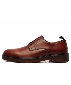The Red Tape Lawrence Leather Mens Shoes are the perfect blend of rustic style and sophisticated comfort, designed for the modern man who values both durability and fashion. Crafted from high-quality leather, these shoes feature a bold silhouette that adds a contemporary edge to any outfit. The leather upper offers both durability and a smooth, refined finish, making them ideal for everyday wear.
With their sturdy crepe styled sole and textured design, these shoes not only provide enhanced support and stability but also make a powerful style statement. The lace-up fastening ensures a secure and adjustable fit, while the cushioned insole guarantees comfort throughout the day. The man-made lining adds breathability, making them suitable for long hours of wear, whether you're heading to work, running errands, or going out for a casual outing.
Versatile enough to pair with jeans, chinos, or even casual trousers, these Red Tape Lawrence Leather Mens Shoes are perfect for a wide range of occasions. Whether you're dressing up or down, these shoes bring an effortlessly stylish and contemporary vibe to your wardrobe. Make a bold impression with these standout shoes that combine modern design, comfort, and durability.

- High-quality Leather upper
- Lace-up fastening
- Heel loop = easy on/off wear
- Cushioned insole
- Comfort lining
- Sturdy crepe styled outsole
- Red Tape branding
Please Note: Red Tape manufacture for many well-known high-street brands and we believe these shoes may have been destined for one of them as they will come to you in an (un)bias Debenhams presentation shoe box.