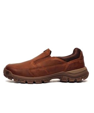 These Caterpillar Threshold slip-on shoes combine ease of wear with exceptional comfort and durability. Featuring a cushioned foam footbed, these shoes provide all-day support, while the soft, breathable nylon mesh sock lining, treated with CLEANSPORT NXT pro-biotic odor control, keeps your feet feeling fresh.
The lightweight EVA midsole adds extra cushioning, and the durable rubber outsole ensures superior traction on various surfaces. Made with premium full-grain leather, these slip-ons deliver both style and functionality, perfect for work, casual outings, or outdoor adventures.

- Premium full gain leather / textile mix upper
- Cushioned foam footbed
- Slip on design for easy on / off wear
- Padded ankle collar
- Mesh sock lining with CLEANSPORT NXT pro-biotic odor control
- EVA midsole heel
- Durable rubber outsole for traction
- Caterpillar branding