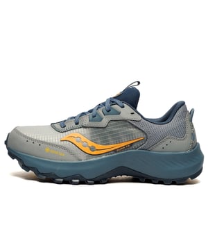 Unpredictable weather wont slow you down with the Saucony Aura TR GTX. Built for runners who refuse to stay indoors, these trail-ready shoes deliver exceptional protection, comfort, and performance. The waterproof GORE-TEX lining keeps your feet dry, while a rugged ripstop finish shields against trail debris.
 VERSARUN cushioning minimizes impact, offering lasting comfort mile after mile, while the grippy outsoleequipped with 4.5mm lugsensures stability on roads and trails alike. A durable XT-600 rubber outsole enhances longevity, and the breathable two-layer mesh upper keeps airflow optimal. Whether facing rain, mud, or rocky paths, the Aura TR GTX keeps you moving with confidence.
 - Breathable two-layer mesh upper
 - Waterproof GORE-TEX construction
 - Lace closure
 - Heel pull tab = easy on / off wear
 - Durable ripstop finish
 - VERSARUN cushioned midsole
 - Durable rubber outsole
 - Comfort cushioned insole
- Saucony branding throughout